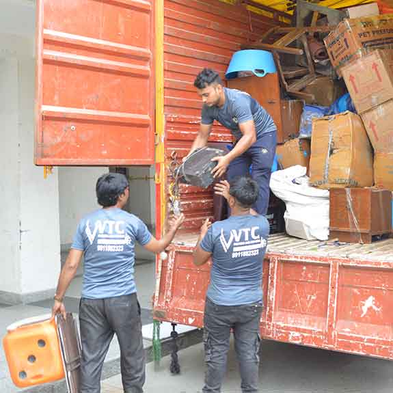 staffs unloading goods from truck